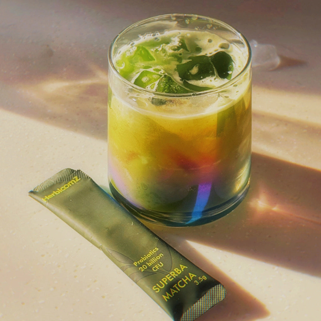 HerbloomZ SUPERBA MATCHA iced drink with mint garnish - refreshing cold probiotic matcha beverage made from single-serve sachet for summer stress relief and gut health support