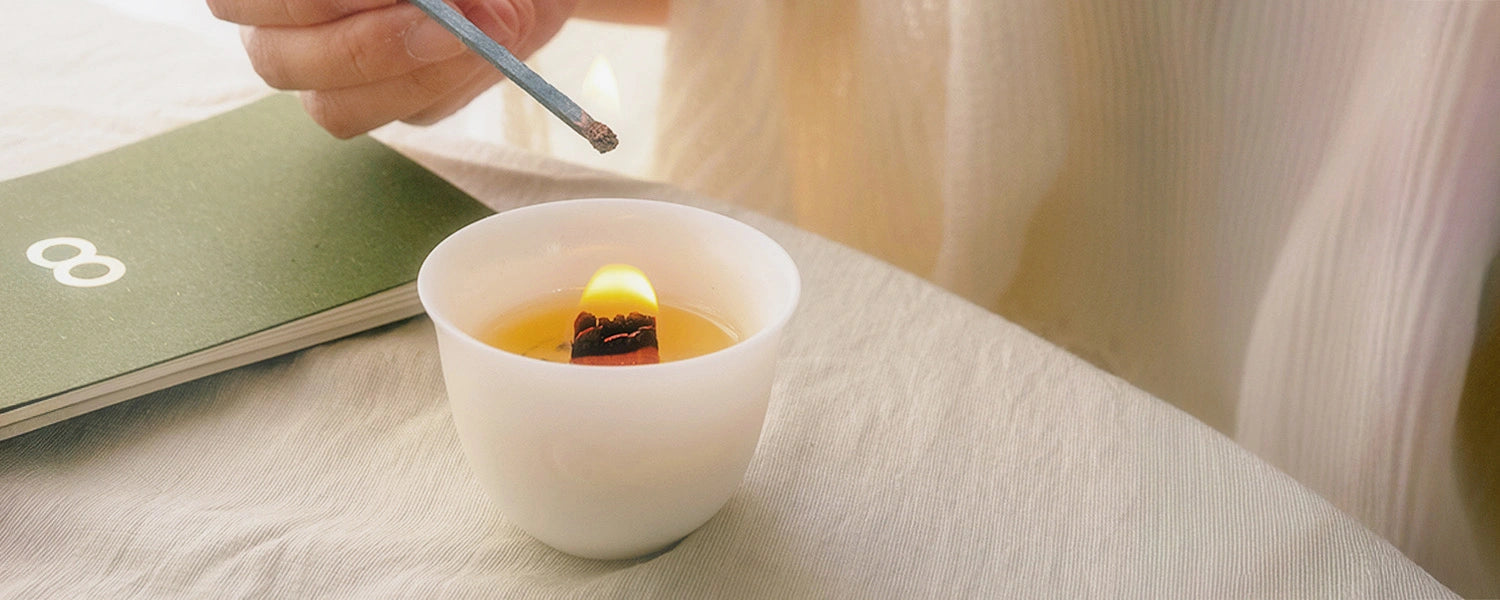 Lighting the bamboo candle from the SUPERBA Matcha Set — a grounding ritual to begin with calm.