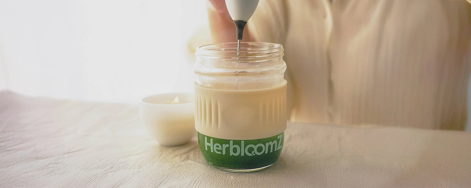 Mixing probiotic SUPERBA Matcha in the Wellness Cup with hot water until smooth jade green.