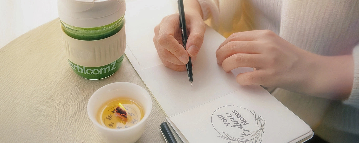 Sipping SUPERBA Matcha with candle and journal — a daily self-care ritual for clarity and balance.