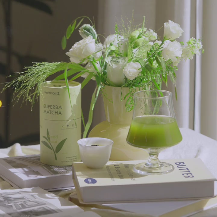 A tranquil, sunlit scene showcasing the HerbloomZ SUPERBA MATCHA and Bamboo Zen candle, creating a perfect moment for a calming daily ritual