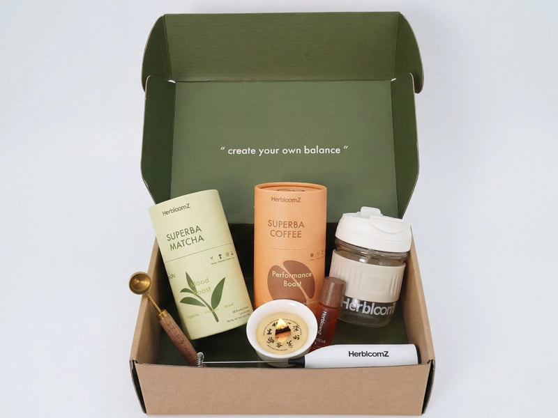 HerbloomZ products including a jar, a bottle, and a container in a green box on a white background.