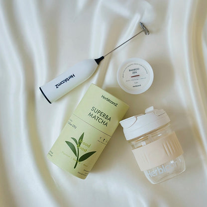 Herbfoamz matcha product set on a white fabric background
