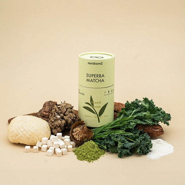 HerbicomZ Superba Matcha container with matcha powder, green leaves, and other ingredients on a beige background
